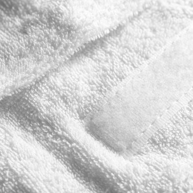 Witte badstof haarband voor comfortabel professioneel gebruik in salon, praktijk en studio bij schoonheidsbehandelingen
