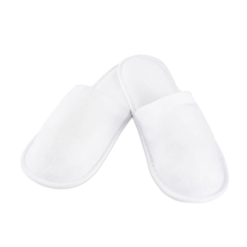 Badstof slippers wit voor eenmalig gebruik, klantcomfort en hygiëne tijdens spa- en schoonheidsbehandelingen in de salon Badstof slippers wit voor eenmalig gebruik, klantcomfort en hygiëne tijdens spa- en schoonheidsbehandelingen in de salon